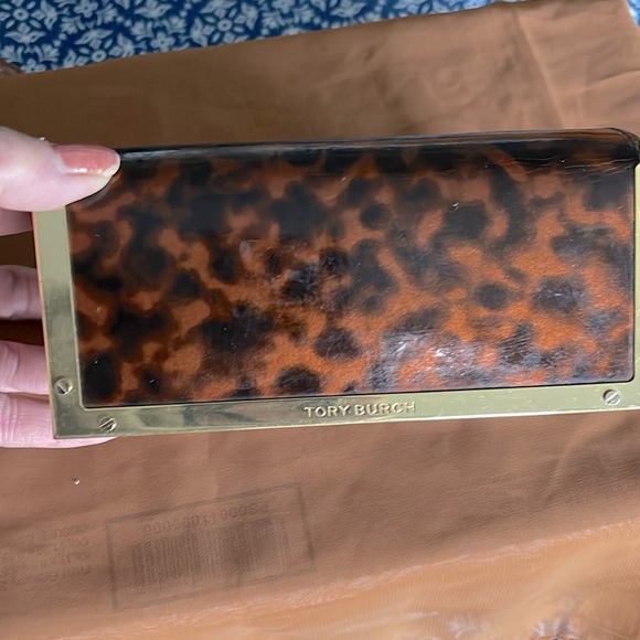 Authentic Tory Burch glass case. Animal print. Magnetic closure. Gold trim . EUC - Picture 4 of 7